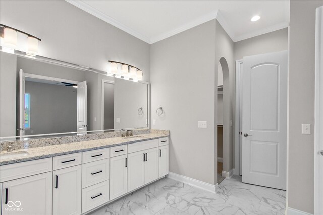 bathroom featuring vanity and ornamental molding