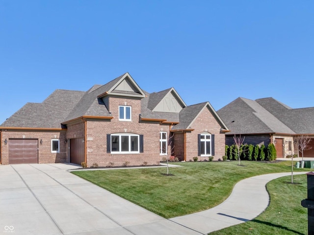 view of front of property with a garage, a front yard, and central AC unit