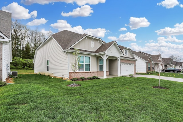 view of front of property with a garage and a front lawn