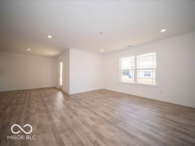 empty room featuring wood-type flooring