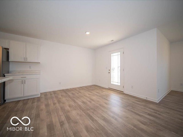 unfurnished living room featuring light wood-type flooring