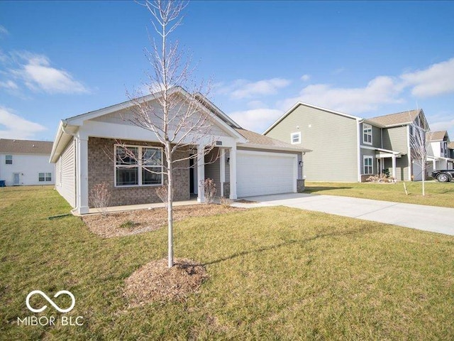 view of front of house featuring a garage and a front lawn