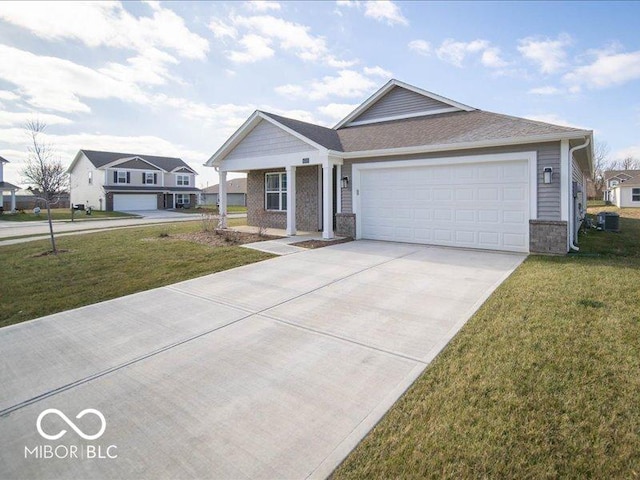 view of front of house with a garage and a front yard