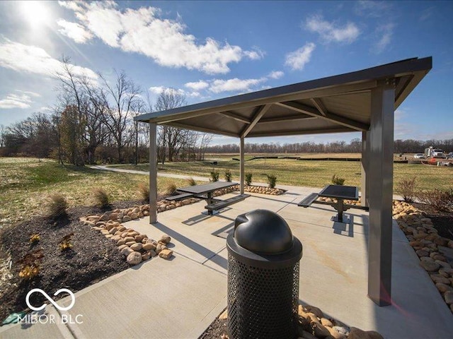 view of patio / terrace featuring a gazebo and a rural view