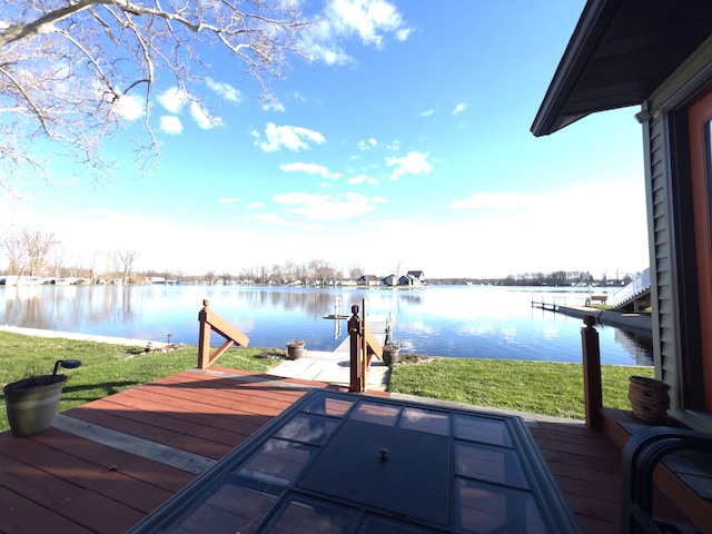 dock area with a water view