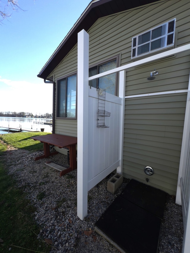 view of side of property with a water view