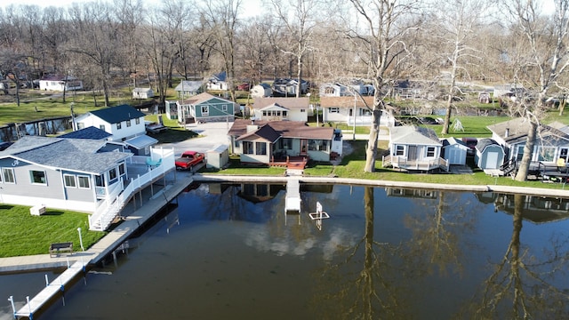 exterior space featuring a yard and a water view