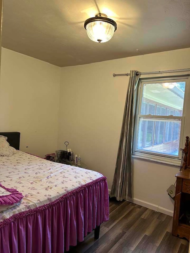 bedroom featuring dark hardwood / wood-style flooring