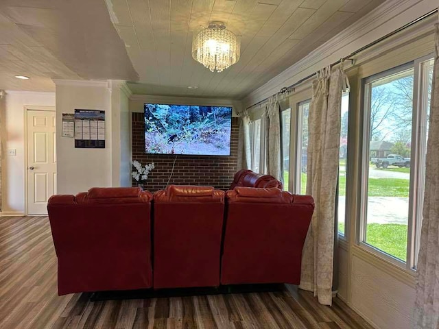 living room featuring ornamental molding, dark hardwood / wood-style flooring, and a wealth of natural light