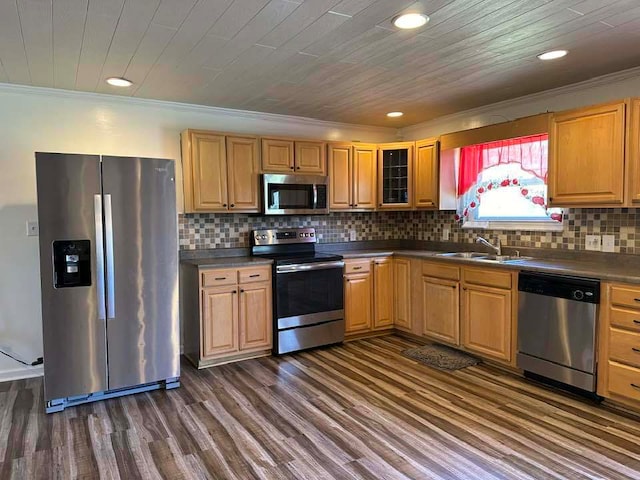 kitchen with stainless steel appliances, backsplash, sink, ornamental molding, and dark hardwood / wood-style floors