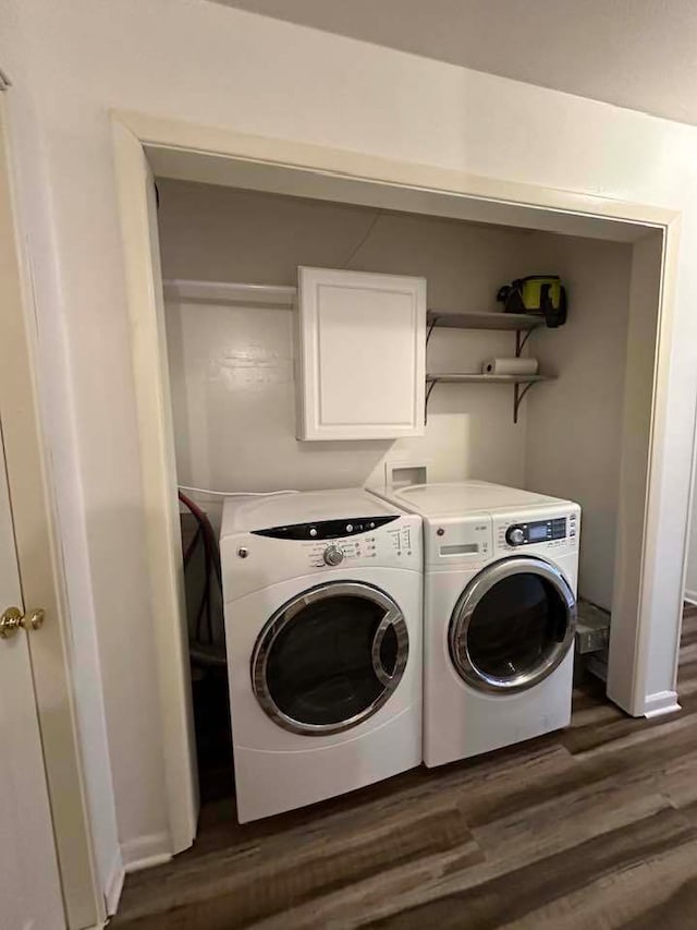 laundry room featuring washer and dryer, dark wood-type flooring, and hookup for a washing machine