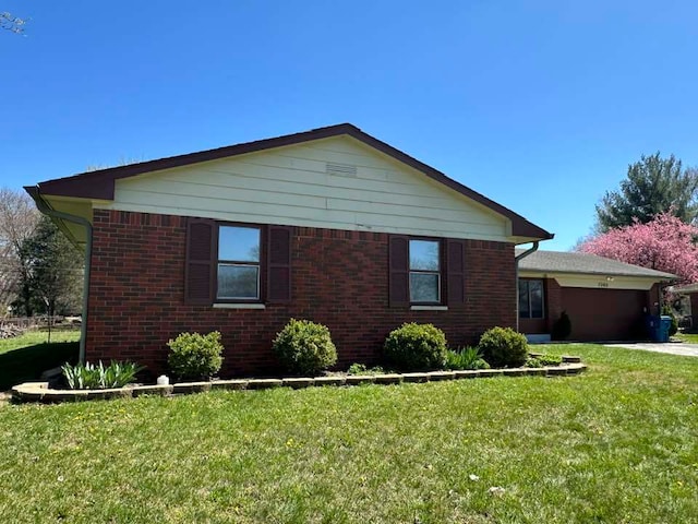 view of side of home featuring a yard