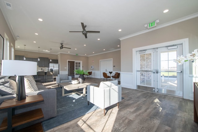 living room with dark hardwood / wood-style floors, crown molding, french doors, and ceiling fan