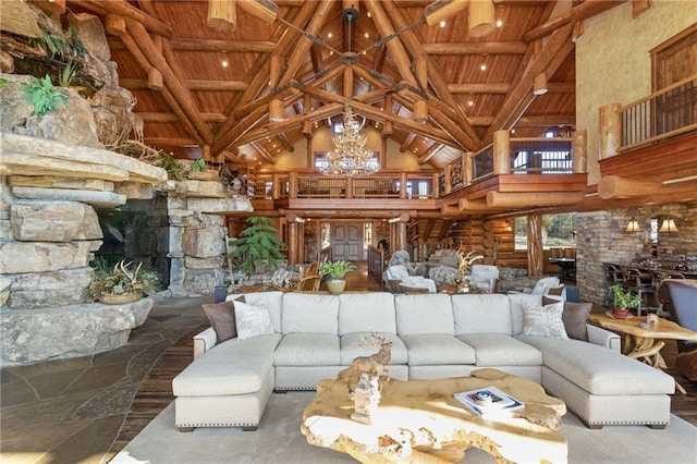 living room with a chandelier, wood ceiling, high vaulted ceiling, and beamed ceiling