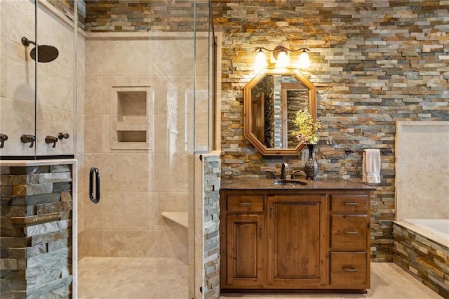 bathroom featuring vanity and plus walk in shower