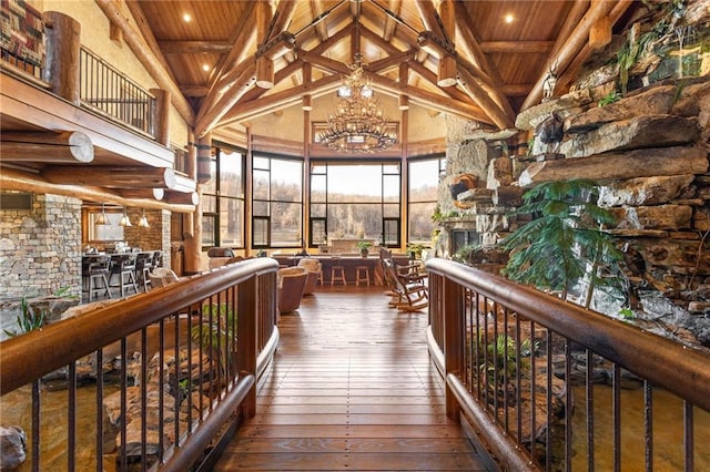 corridor featuring wood ceiling, dark hardwood / wood-style flooring, and beamed ceiling