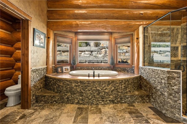 bathroom featuring tile floors, log walls, toilet, and separate shower and tub