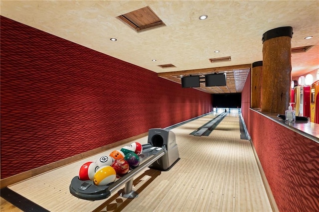 game room with a bowling alley