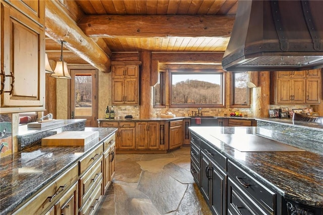 kitchen featuring a healthy amount of sunlight, wood ceiling, and beamed ceiling