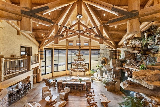 sunroom featuring wood ceiling and lofted ceiling with beams