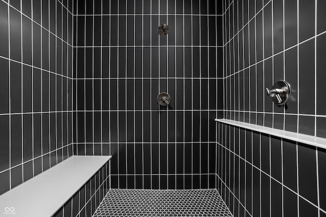 bathroom with tiled shower