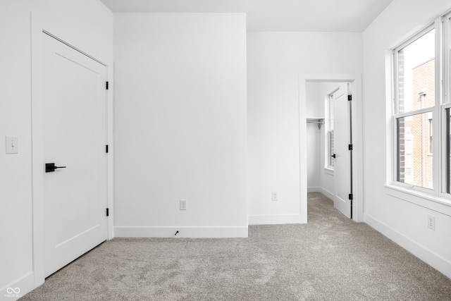 unfurnished bedroom with light carpet