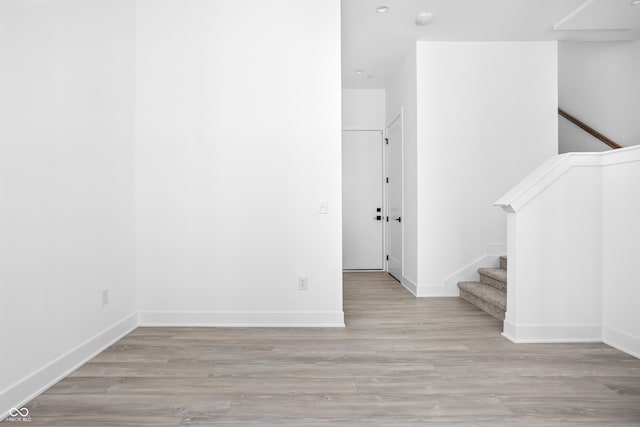 spare room featuring light wood-type flooring