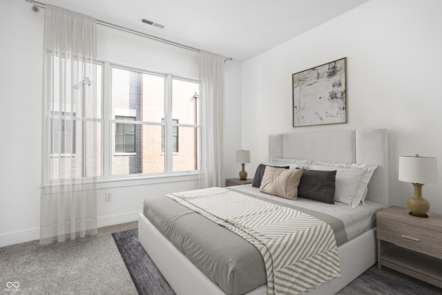 bedroom featuring carpet and multiple windows