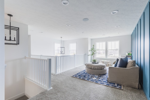 interior space featuring a textured ceiling and an inviting chandelier