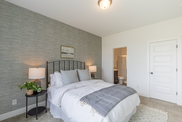 carpeted bedroom featuring ensuite bathroom