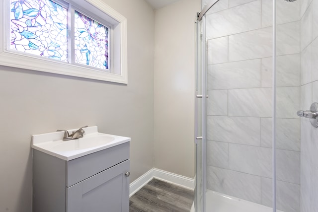 bathroom with vanity and hardwood / wood-style floors