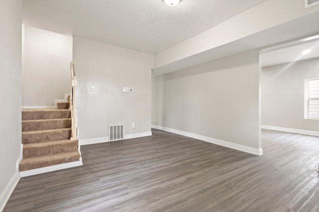 basement featuring dark wood-type flooring