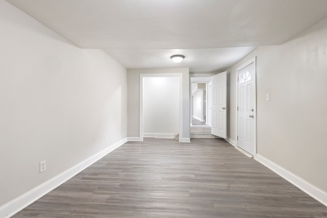 empty room with dark hardwood / wood-style floors