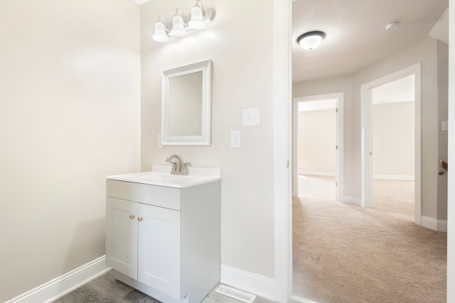 bathroom featuring vanity with extensive cabinet space