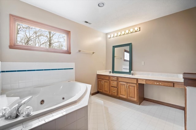 bathroom with double vanity and tile patterned floors