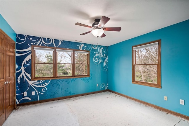 unfurnished room with ceiling fan