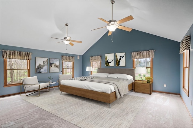 carpeted bedroom featuring high vaulted ceiling and ceiling fan