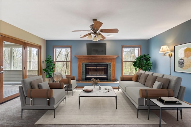 living room with ceiling fan and a wealth of natural light