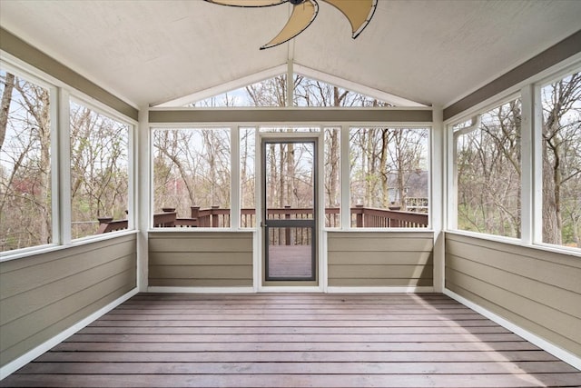 unfurnished sunroom with lofted ceiling