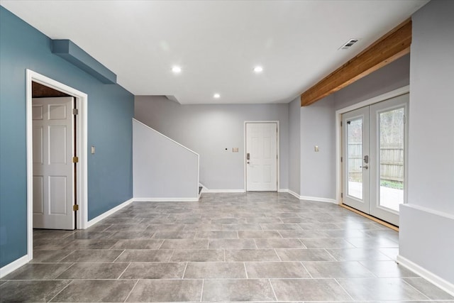 tiled spare room with french doors