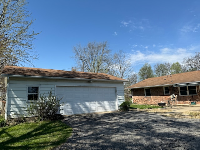 view of side of property featuring a garage