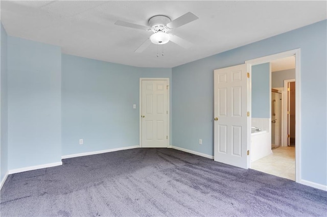 unfurnished room featuring light carpet and ceiling fan