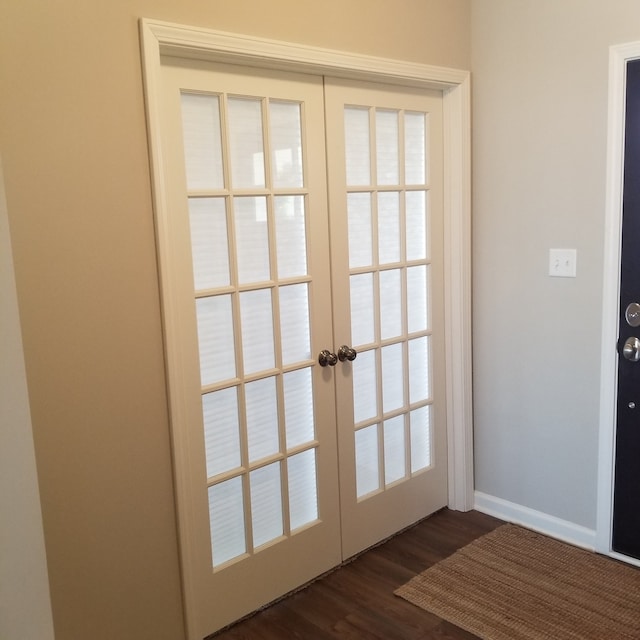 doorway to outside featuring french doors and dark hardwood / wood-style flooring