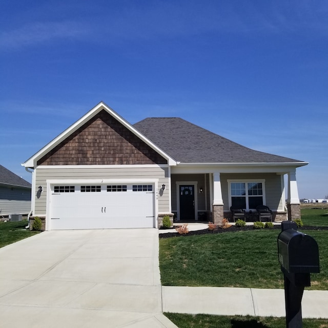 craftsman-style house with a front lawn and a garage