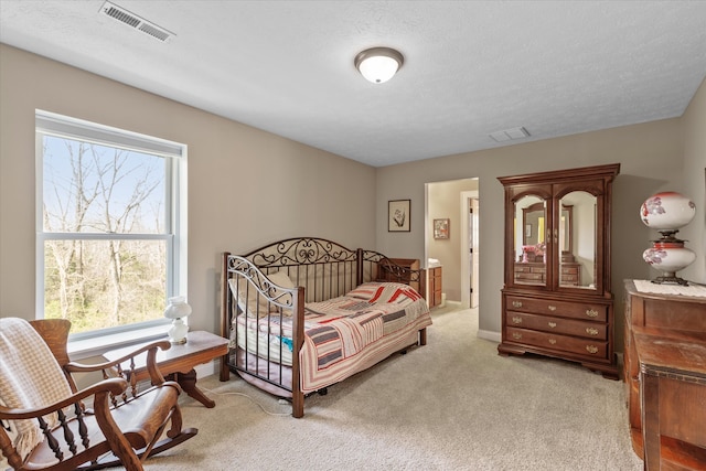 carpeted bedroom featuring a textured ceiling