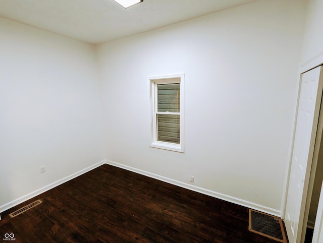 spare room featuring hardwood / wood-style floors