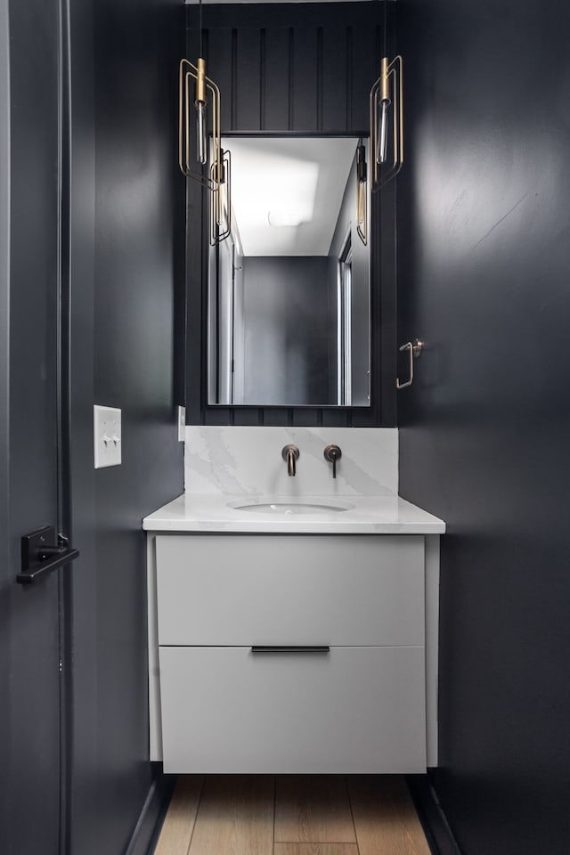 bathroom featuring vanity and hardwood / wood-style flooring