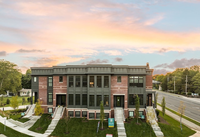 view of back house at dusk