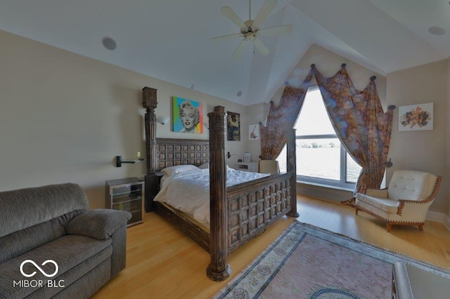 bedroom featuring hardwood / wood-style floors, ceiling fan, and lofted ceiling