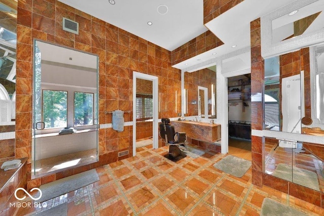 bathroom featuring tile walls and tile flooring